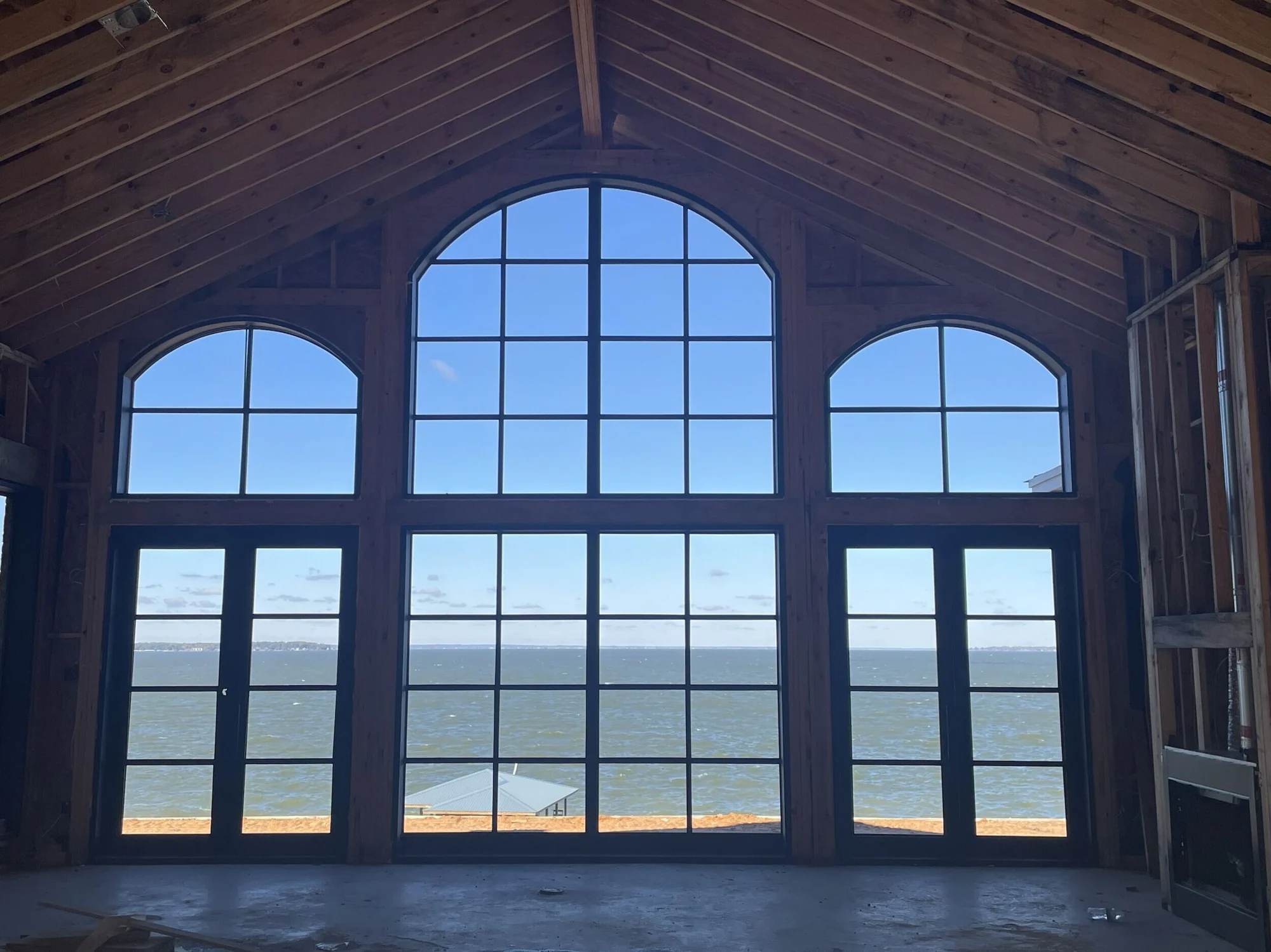 Allen arched window wall during framing